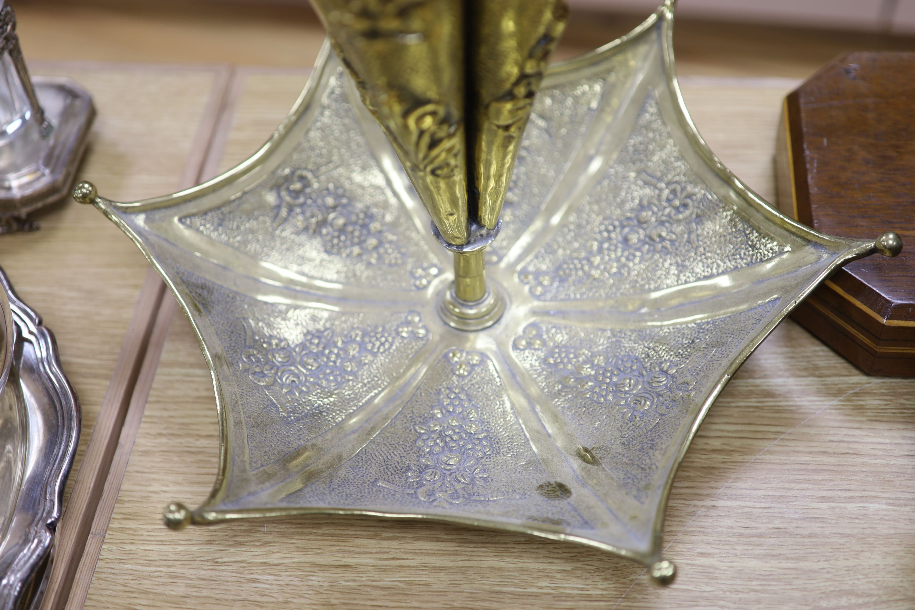 A Dutch brass embossed parasol shaped stick stand, height 91cm